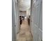 Bright hallway with tile floors connecting the kitchen to other rooms at 2621 Slide Canyon Ave, North Las Vegas, NV 89081