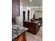 Open kitchen with island, granite counters and view to Gathering room at 2621 Slide Canyon Ave, North Las Vegas, NV 89081