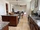 Open kitchen with island, granite counters and view to Gathering room at 2621 Slide Canyon Ave, North Las Vegas, NV 89081