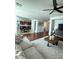 Open living room with hardwood floors and views into the kitchen and dining area at 2621 Slide Canyon Ave, North Las Vegas, NV 89081