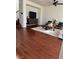 Living room with hardwood floors, a large TV, and comfortable seating at 2621 Slide Canyon Ave, North Las Vegas, NV 89081