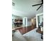 Open living room with hardwood floors and views into the kitchen and dining area at 2621 Slide Canyon Ave, North Las Vegas, NV 89081