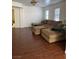 Living room with sectional sofa and hardwood floors at 2621 Slide Canyon Ave, North Las Vegas, NV 89081