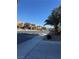 Residential street with houses and palm trees at 2621 Slide Canyon Ave, North Las Vegas, NV 89081