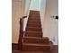 Elegant wooden staircase leading to the upper level at 2621 Slide Canyon Ave, North Las Vegas, NV 89081