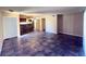 Spacious living room with tile floors and kitchen view at 2750 S Durango Dr # 1038, Las Vegas, NV 89117