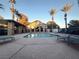 Community pool with lounge chairs and palm trees at 2750 S Durango Dr # 1038, Las Vegas, NV 89117