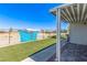 Lush backyard with patio, artificial turf, and scenic mountain views at 2931 Rodeo Ave, Pahrump, NV 89048