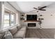 Living room with fireplace, built-in shelves, and large windows at 2931 Rodeo Ave, Pahrump, NV 89048