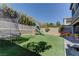 Spacious backyard with playset, trampoline and artificial turf at 319 Cooper Hawk Ct, Las Vegas, NV 89138