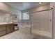 Elegant bathroom with soaking tub, walk-in shower, and modern vanity at 319 Cooper Hawk Ct, Las Vegas, NV 89138