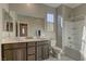 Clean bathroom with double sinks, bathtub, and separate shower at 319 Cooper Hawk Ct, Las Vegas, NV 89138