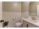 Elegant powder room with white quartz countertop and brass fixtures at 319 Cooper Hawk Ct, Las Vegas, NV 89138
