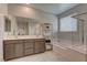 Bathroom boasts double vanity, soaking tub, and glass shower at 319 Cooper Hawk Ct, Las Vegas, NV 89138