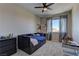 Cozy bedroom with a daybed and plenty of natural light at 319 Cooper Hawk Ct, Las Vegas, NV 89138
