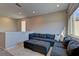 Spacious Gathering room with sectional sofa and a large window at 319 Cooper Hawk Ct, Las Vegas, NV 89138