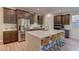 Modern kitchen with dark cabinetry and a large island at 319 Cooper Hawk Ct, Las Vegas, NV 89138