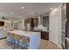 Modern kitchen with large island, stainless steel appliances, and dark wood cabinets at 319 Cooper Hawk Ct, Las Vegas, NV 89138