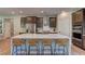 Spacious kitchen featuring a large island with seating and modern appliances at 319 Cooper Hawk Ct, Las Vegas, NV 89138