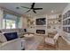 Spacious living room with a fireplace and built-in shelves at 319 Cooper Hawk Ct, Las Vegas, NV 89138