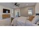 Bright and airy main bedroom with king-size bed and dresser at 319 Cooper Hawk Ct, Las Vegas, NV 89138