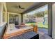 Spacious covered patio overlooking the backyard with a seating area at 319 Cooper Hawk Ct, Las Vegas, NV 89138