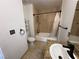 Bathroom featuring a shower-tub combo with modern fixtures and neutral tile at 3891 Terrazzo Ave, Las Vegas, NV 89115