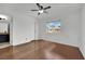 Bright bedroom with hardwood floors, a ceiling fan, and a window offering natural light and outside views at 3891 Terrazzo Ave, Las Vegas, NV 89115