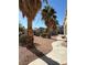 Community grounds with walking paths, mature trees, and desert landscaping at 3891 Terrazzo Ave, Las Vegas, NV 89115