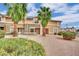 Property boasts desert landscaping, mature palms and neutral exterior paint at 3891 Terrazzo Ave, Las Vegas, NV 89115