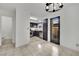 Galley kitchen featuring stainless steel appliances and dark cabinetry, seamlessly connected to the dining area at 3891 Terrazzo Ave, Las Vegas, NV 89115
