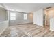 Open concept living room with high ceilings and wood-look flooring at 4174 Jacqueline Way, Las Vegas, NV 89115