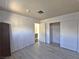 Spacious bedroom featuring wood-look floors and a large closet at 4413 Buckeye Ave, Las Vegas, NV 89102