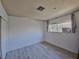 Bright bedroom with wood-look floors and ample closet space at 4413 Buckeye Ave, Las Vegas, NV 89102