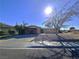 Ranch style home with carport and mature tree in front yard at 4413 Buckeye Ave, Las Vegas, NV 89102