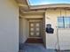 Front entrance with double doors and a small covered porch at 4413 Buckeye Ave, Las Vegas, NV 89102