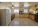 Bright kitchen with wood cabinets, appliances, and tiled floor at 4413 Buckeye Ave, Las Vegas, NV 89102