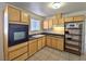 View of kitchen with wood cabinets and appliances at 4413 Buckeye Ave, Las Vegas, NV 89102