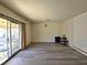 Living room with sliding glass door and vinyl flooring at 4413 Buckeye Ave, Las Vegas, NV 89102