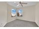 Bright bedroom featuring a ceiling fan and large windows at 476 Tiger Lily Way, Henderson, NV 89015