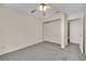 Bedroom featuring grey carpet, ceiling fan and built-in closet at 476 Tiger Lily Way, Henderson, NV 89015