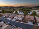 Aerial view of the home and community with lake, golf course, and mountain views at 5130 Agio Ave, Pahrump, NV 89061