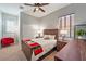 Bedroom with a wooden bed frame and a ceiling fan at 5130 Agio Ave, Pahrump, NV 89061