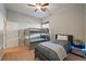 Cozy bedroom features a bunk bed, a single bed, and a bedside table with a glowing nightlight for a modern touch at 5130 Agio Ave, Pahrump, NV 89061
