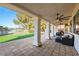 Spacious covered patio with ceiling fans overlooking well-manicured lawns and a serene lake at 5130 Agio Ave, Pahrump, NV 89061