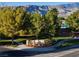Elegant entrance to the Mountain Falls community with beautiful landscaping at 5130 Agio Ave, Pahrump, NV 89061