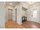 Bright foyer featuring wood and tile floors, gray walls and recessed alcoves at 5130 Agio Ave, Pahrump, NV 89061