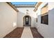 Inviting walkway leading to a front door in an arched doorway at 5130 Agio Ave, Pahrump, NV 89061