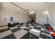 The expansive garage is complete with checkered flooring, work space, and storage for hobbies and vehicles at 5130 Agio Ave, Pahrump, NV 89061