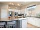 Well-lit kitchen with stainless steel appliances, granite countertops, and island with bar stool seating at 5130 Agio Ave, Pahrump, NV 89061